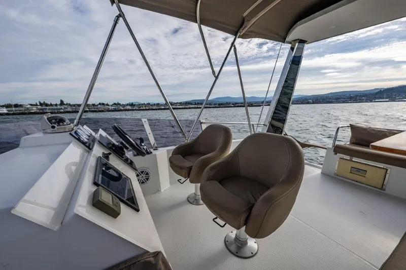 Slide: The Image of The image shows the helm of a 2016 Fountaine Pajot Motor Yacht 37 with two comfortable seats. - 11