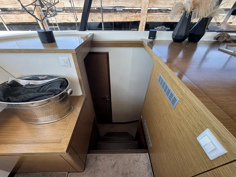 Slide: The Image of Interior of a 2016 Fountaine Pajot Motor Yacht 37 with stairs and wooden furnishings. - 30