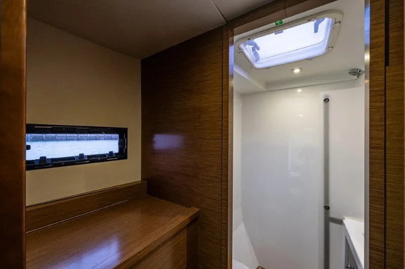Slide: The Image of Interior of a 2016 Fountaine Pajot Motor Yacht 37 with wood paneling and a skylight. - 33