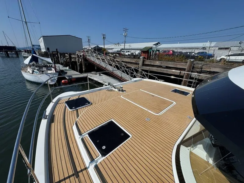 Slide: The Image of The deck of a 2016 Fountaine Pajot Motor Yacht 37 with wood finish and several hatches. - 39