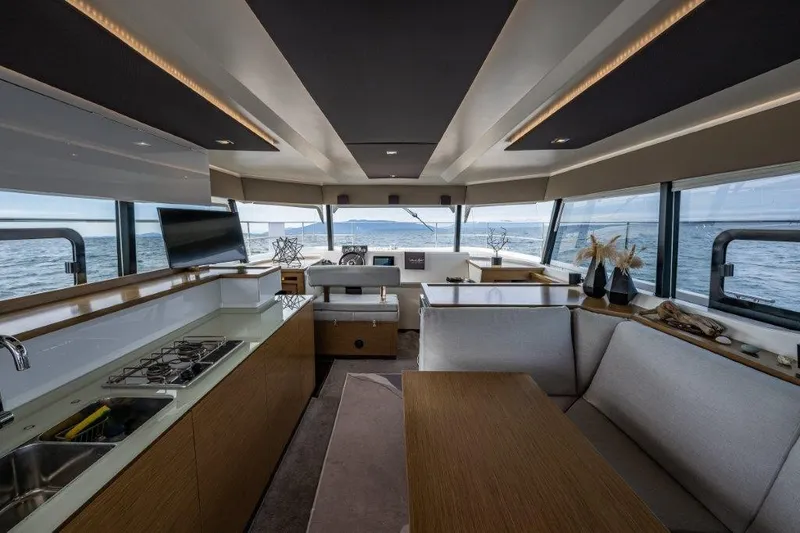 Slide: The Image of Interior of a 2016 Fountaine Pajot Motor Yacht 37 with modern kitchen and dining area. - 13
