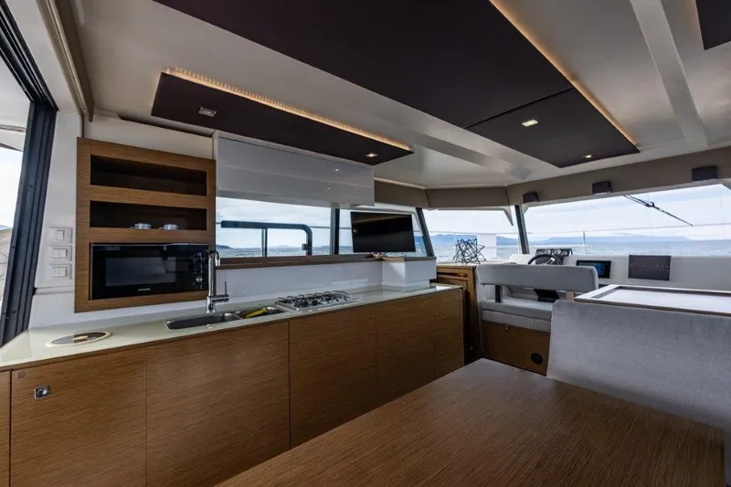 Slide: The Image of Interior of a 2016 Fountaine Pajot Motor Yacht 37 with modern kitchen and panoramic windows. - 14