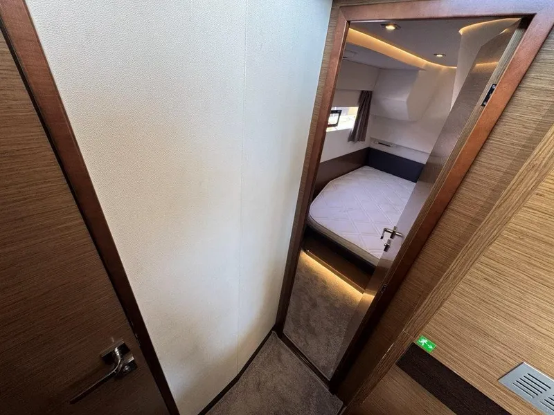 Slide: The Image of An elegant bedroom in a 2016 Fountaine Pajot Motor Yacht 37 with a cozy bed. - 32