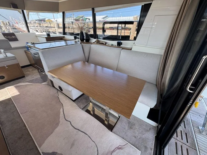 Slide: The Image of Interior of a 2016 Fountaine Pajot Motor Yacht 37 with a modern dining area. - 7