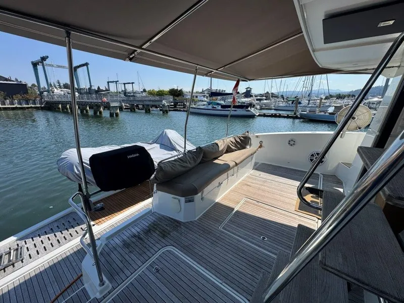 Slide: The Image of The image shows the aft deck of a 2016 Fountaine Pajot Motor Yacht 37. - 3