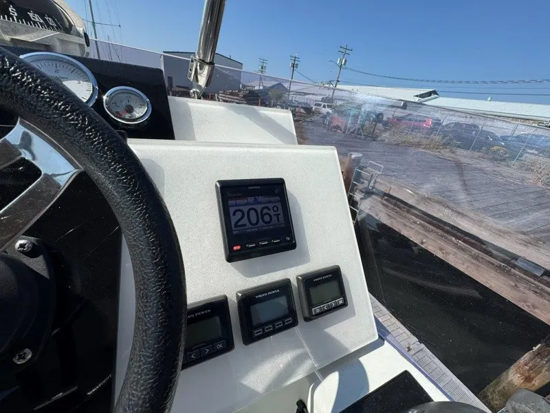 Slide: The Image of The image shows the helm of a 2016 Fountaine Pajot Motor Yacht 37. - 45