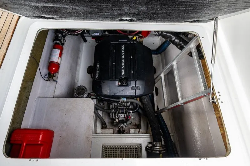 Slide: The Image of The engine compartment of a 2016 Fountaine Pajot Motor Yacht 37 features a Volvo Penta engine. - 38