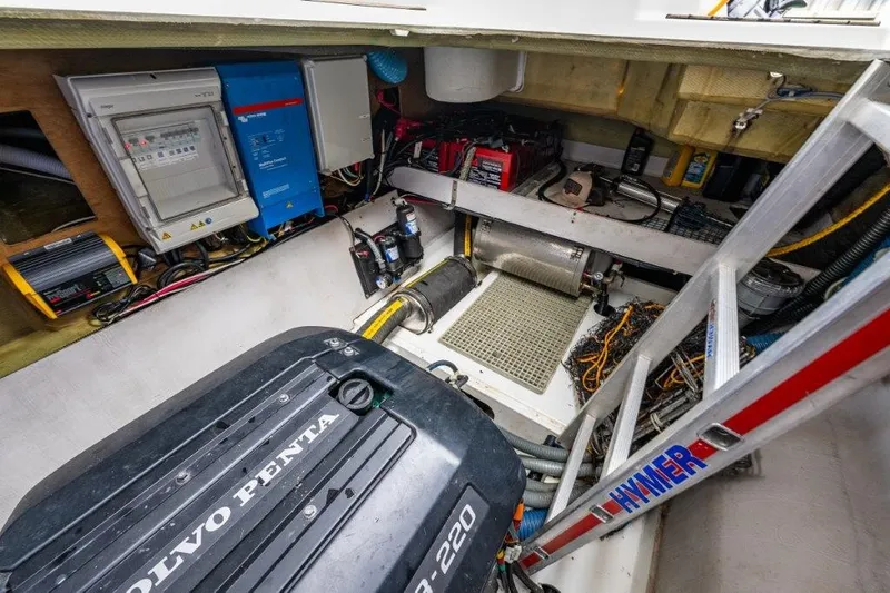 Slide: The Image of The engine room of a 2016 Fountaine Pajot Motor Yacht 37 features a Volvo Penta engine and various technical equipment. - 37