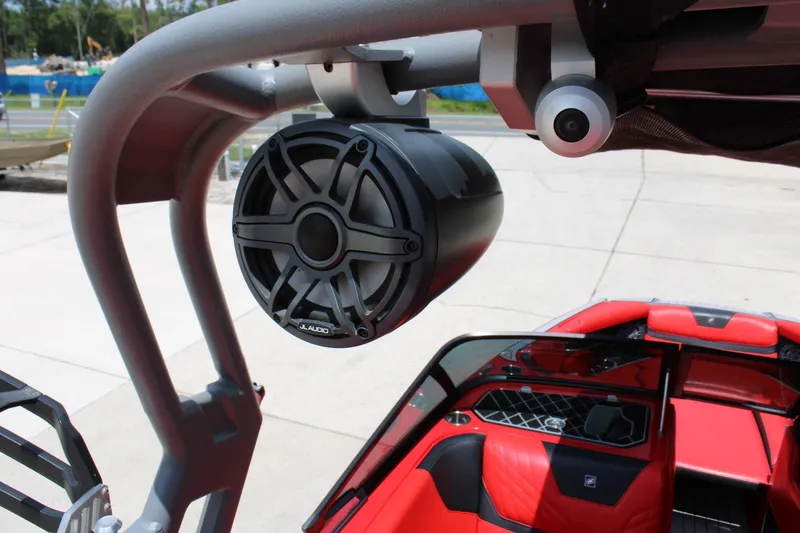 Slide: The Image of A speaker is mounted on a roll bar of a 2021 Nautique Super Air Nautique GS22. - 13