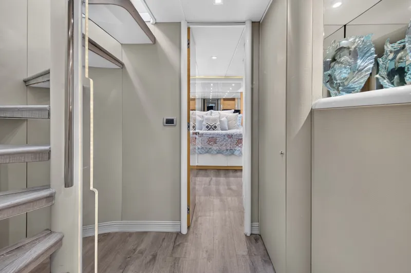 Slide: The Image of A sleek interior with stairs leading to a bedroom featuring decorative pillows. - 21