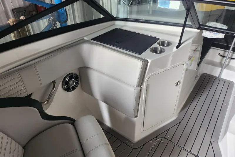 Slide: The Image of 2022 Sea Ray SPX 210 Outboard interior with seating, cup holders, and sleek design. - 18