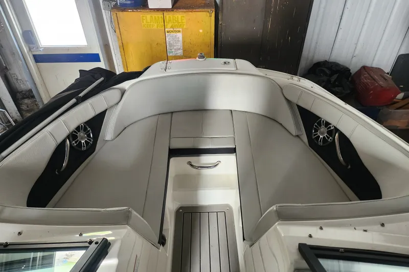 Slide: The Image of 2022 Sea Ray SPX 210 Outboard boat interior with sleek seating and modern design. - 9