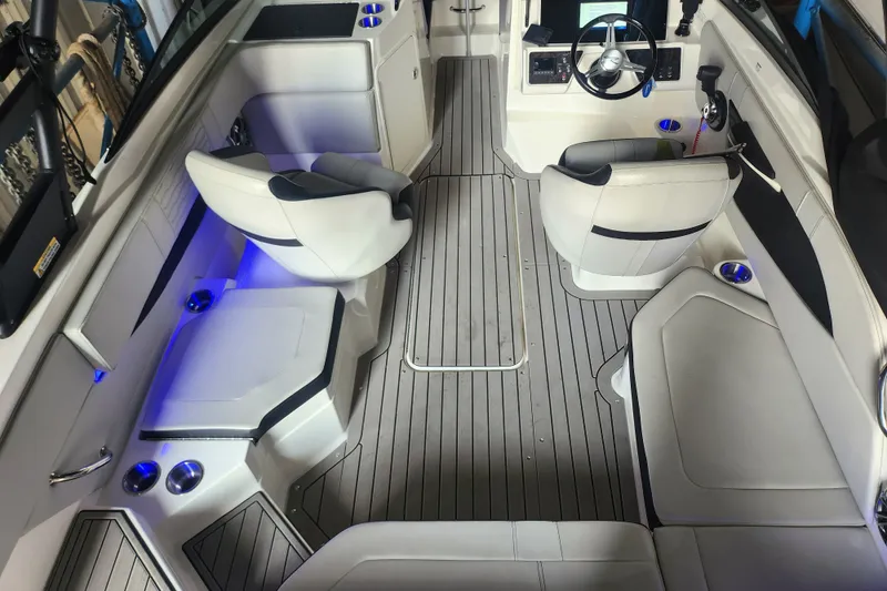 Slide: The Image of 2022 Sea Ray SPX 210 Outboard interior with modern seating and sleek design. - 6