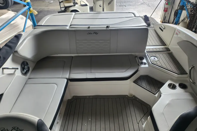 Slide: The Image of 2022 Sea Ray SPX 210 Outboard interior with sleek seating and modern design. - 4