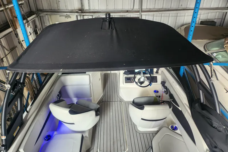 Slide: The Image of 2022 Sea Ray SPX 210 Outboard boat interior with canopy and seating. - 7
