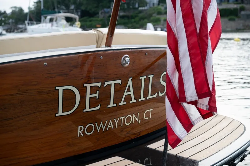 Slide: The Image of Hinckley Talaria 29C boat, 2014 model, with American flag, docked in Rowayton, CT. - 4