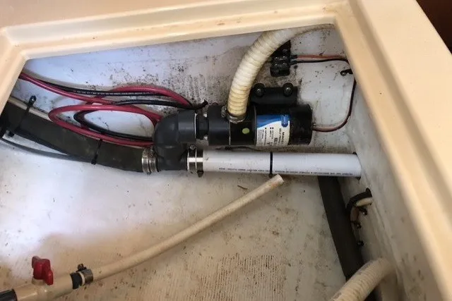 Slide: The Image of Electrical and plumbing components inside a 2000 Island Packet 320 sailboat. - 47
