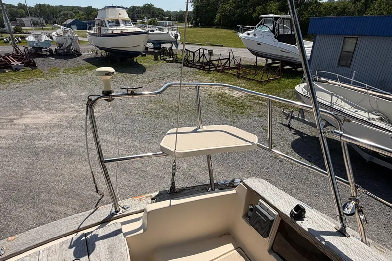 Slide: The Image of 2000 Island Packet 320 sailboat on land, surrounded by other boats in a marina. - 38