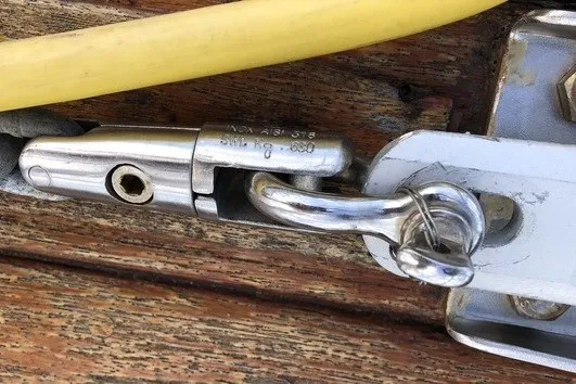 Slide: The Image of Stainless steel boat fitting on Island Packet 320, 2000 model, with yellow cable. - 21