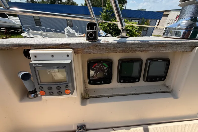 Slide: The Image of Control panel of a 2000 Island Packet 320 sailboat with navigation instruments. - 42