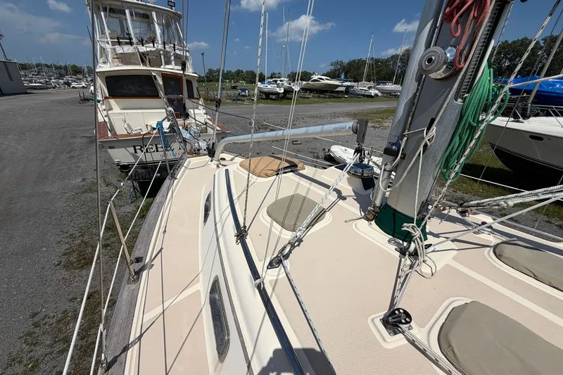 Slide: The Image of Island Packet 320 sailboat from 2000 docked, showcasing deck and rigging details. - 24