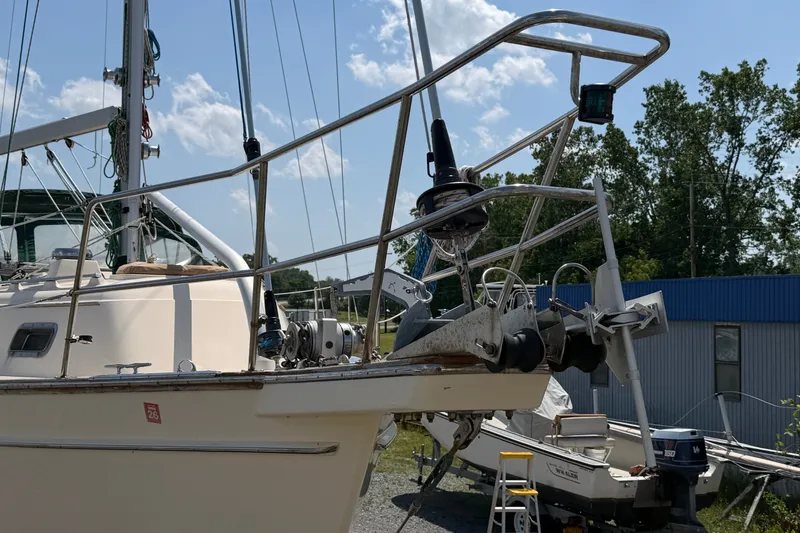 Slide: The Image of Island Packet 320 sailboat from 2000, docked with clear blue sky background. - 18
