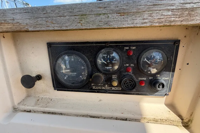 Slide: The Image of Control panel of a 2000 Island Packet 320 yacht with gauges and switches. - 40