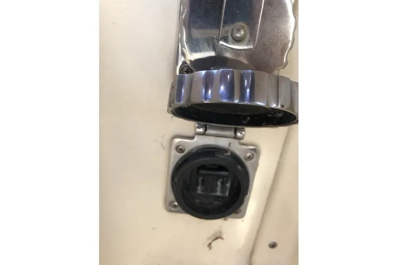 Slide: The Image of Close-up of a 2000 Island Packet 320 boat's chrome fuel cap and socket. - 91