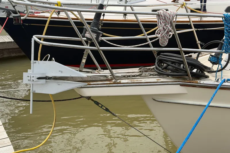 Slide: The Image of Bow of a 2000 Island Packet 320 sailboat with ropes and anchor. - 8