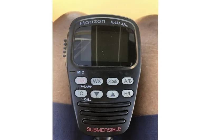 Slide: The Image of Horizon RAM Mic on Island Packet 320, 2000 model, featuring submersible design and control buttons. - 70