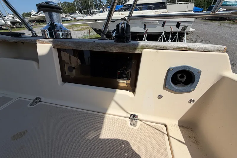 Slide: The Image of Cockpit view of a 2000 Island Packet 320 sailboat, showcasing deck fittings and controls. - 39