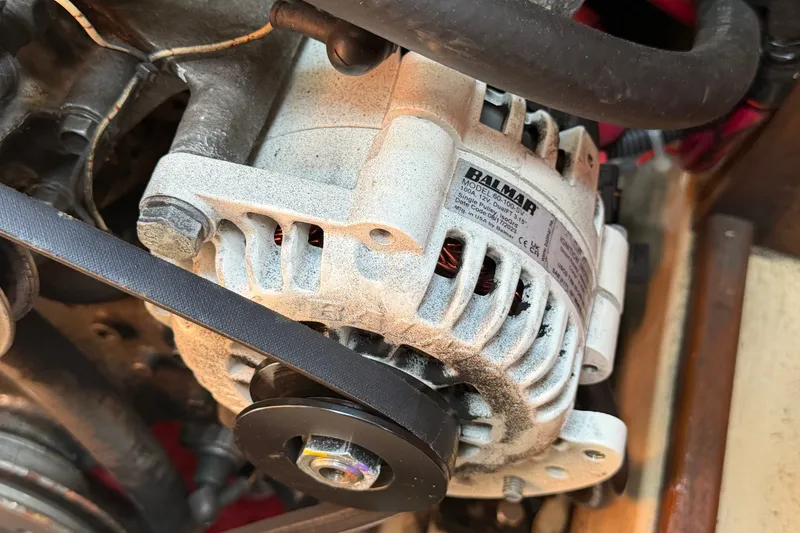 Slide: The Image of Alternator in a 2000 Island Packet 320 sailboat engine compartment. - 86