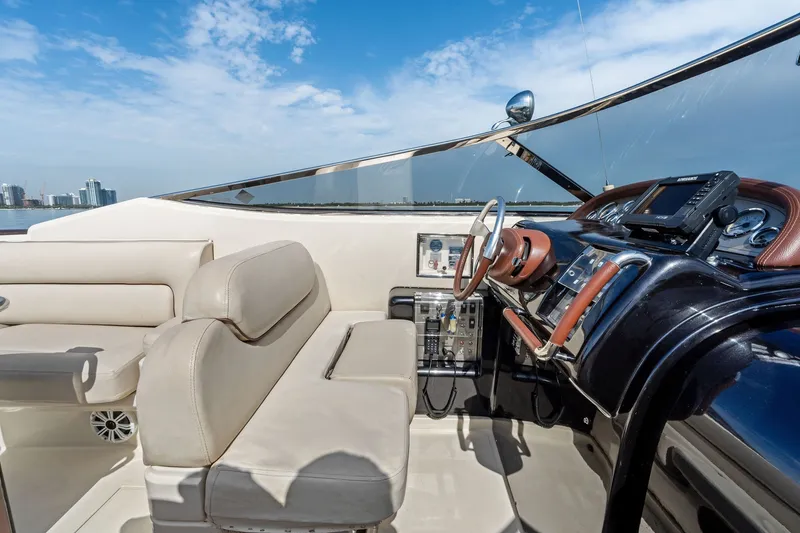 Slide: The Image of Luxurious 2006 Riva 33' Aquariva yacht interior with leather seating and modern dashboard. - 18