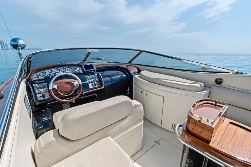 Slide: The Image of Luxurious 2006 Riva 33' Aquariva yacht interior with elegant dashboard and seating. - 13