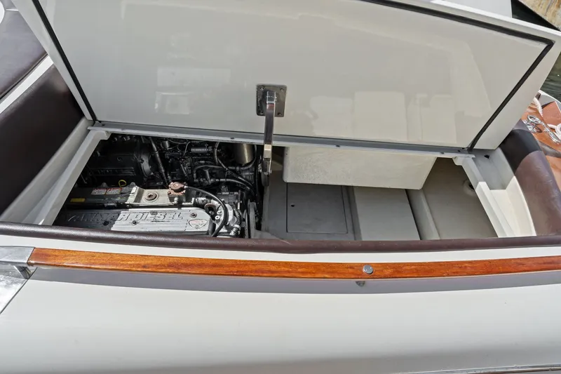 Slide: The Image of Open engine compartment of a 2006 Riva 33' Aquariva boat, showcasing detailed mechanics. - 19