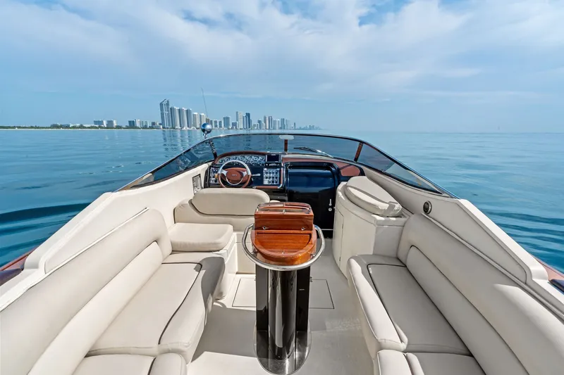 Slide: The Image of Luxurious 2006 Riva 33' Aquariva yacht interior with city skyline view. - 8