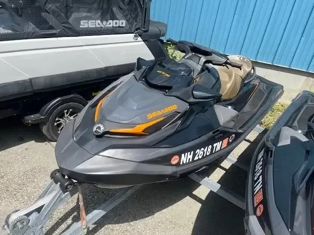 Slide: The Image of A black 2022 Sea-Doo GTX 170 SS iDF jet ski is on a trailer. - 3