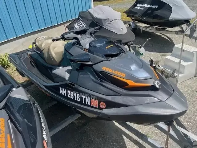 Slide: The Image of A 2022 Sea-Doo GTX 170 SS iDF on a trailer, surrounded by other watercraft. - 3