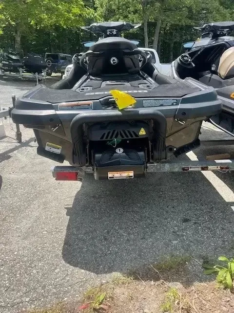 Slide: The Image of A 2022 Sea-Doo GTX 170 SS iDF parked on a trailer, surrounded by trees. - 4