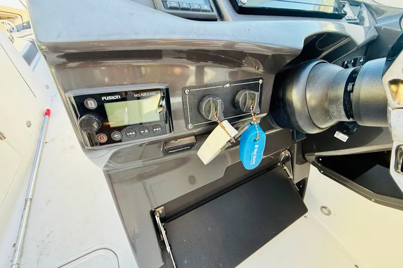 Slide: The Image of 2020 Monterey 328SS Super Sport dashboard with Fusion MS-NRX300 stereo controls. - 9