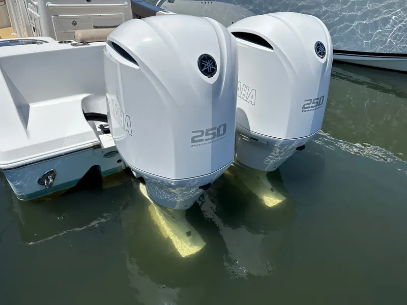 Slide: The Image of Two Yamaha 250 outboard engines on a Sportsman Open 282 Center Console boat in the water. - 36