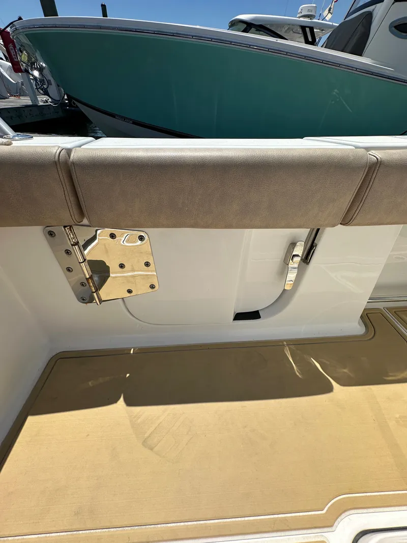 Slide: The Image of The image shows the seating area of a 2019 Sportsman Open 282 Center Console boat. - 16