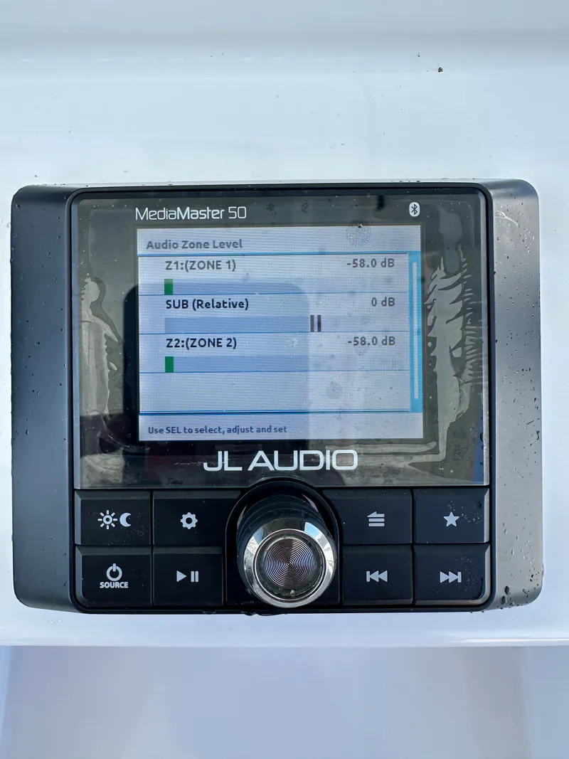 Slide: The Image of JL Audio MediaMaster 50 control with volume knob and display. - 10