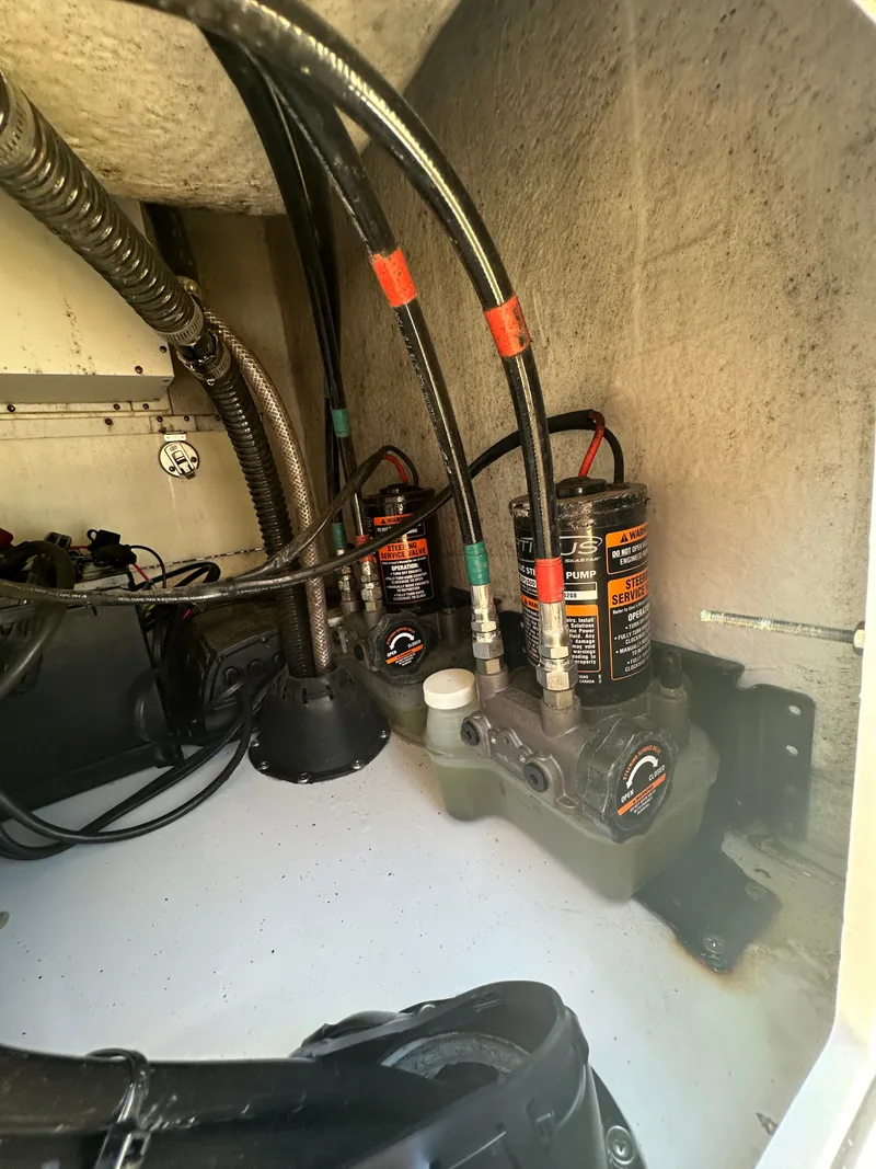 Slide: The Image of Close-up of the engine compartment with hydraulic pumps and cables. - 32