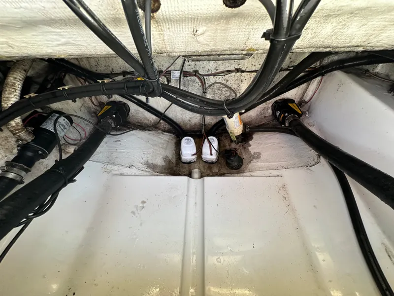Slide: The Image of A view inside the engine compartment of a 2019 Sportsman Open 282 Center Console boat. - 29