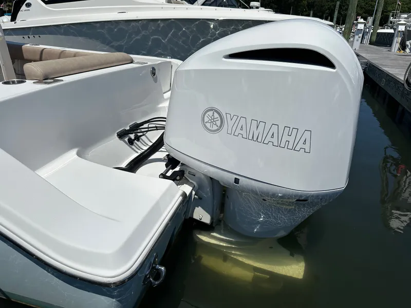 Slide: The Image of A 2019 Sportsman Open 282 Center Console with a Yamaha outboard motor in the water. - 35