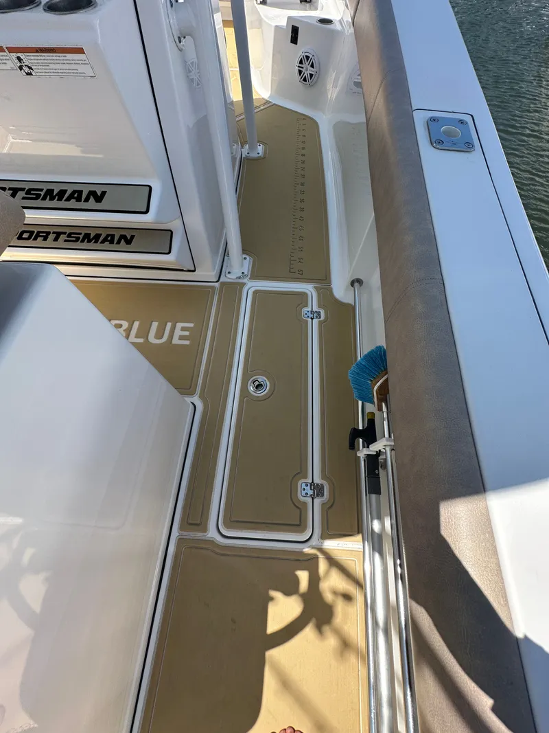 Slide: The Image of The image shows the deck of a 2019 Sportsman Open 282 Center Console boat with non-slip flooring. - 18