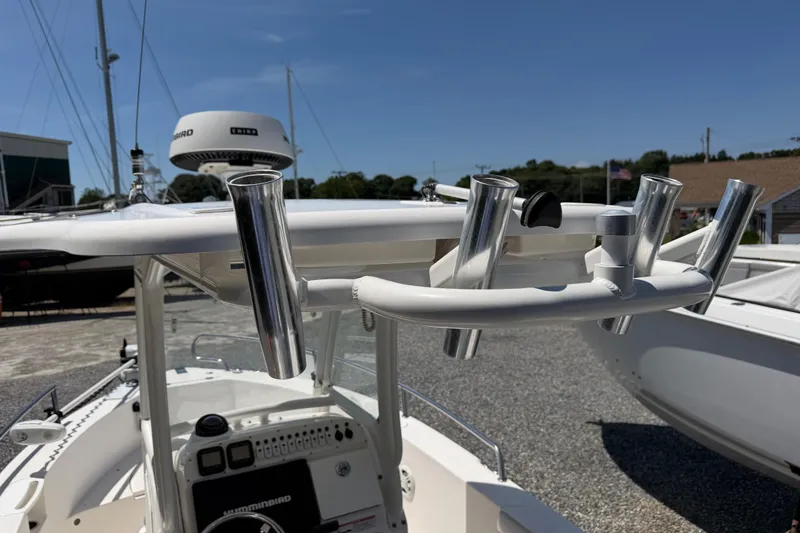 Slide: The Image of 2013 Everglades 210 Center Console boat with rod holders and navigation equipment. - 22