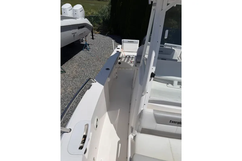 Slide: The Image of 2013 Everglades 210 Center Console boat interior with seating and console view. - 11