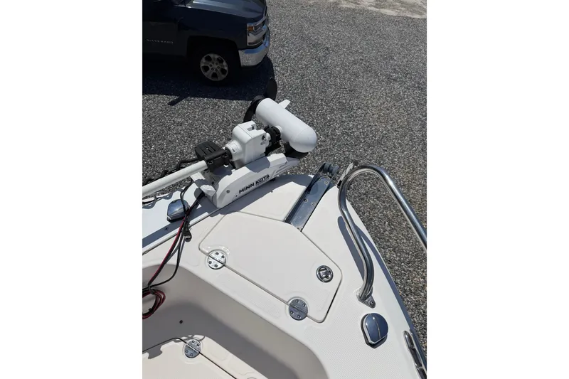 Slide: The Image of 2013 Everglades 210 Center Console boat with Minn Kota trolling motor on deck. - 14